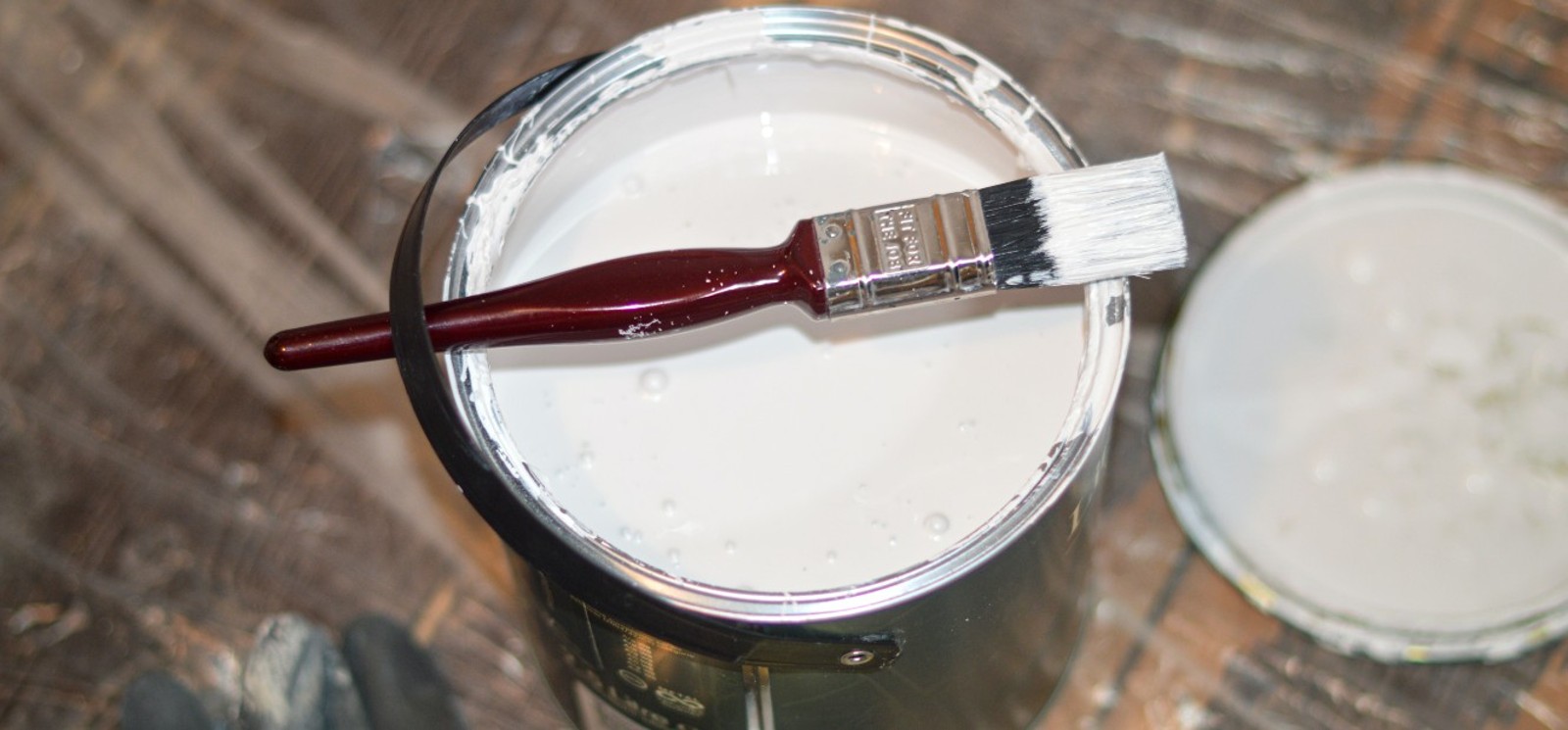 Paint brush sitting on a paint can