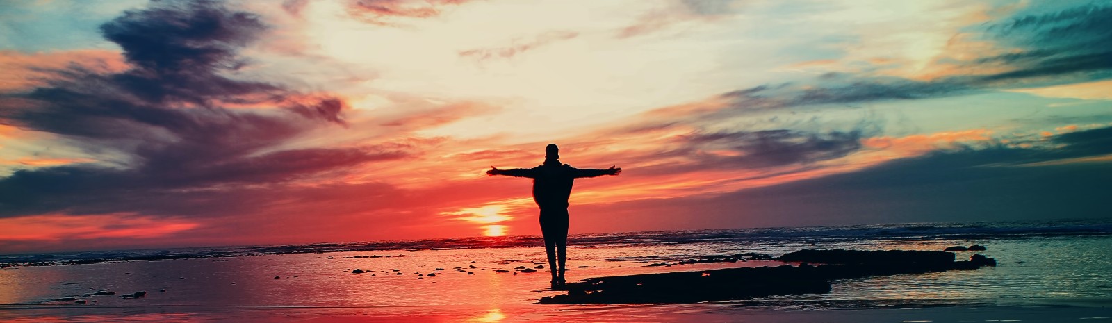 Man at sunset on the beach